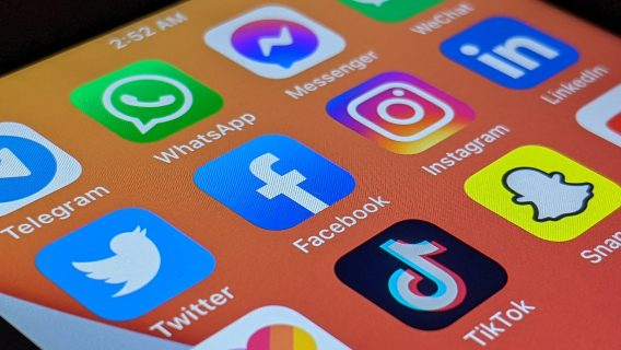 Image shows a phone screen showing apps with social media logos.