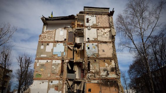 Image shows a damaged building in Ukraine